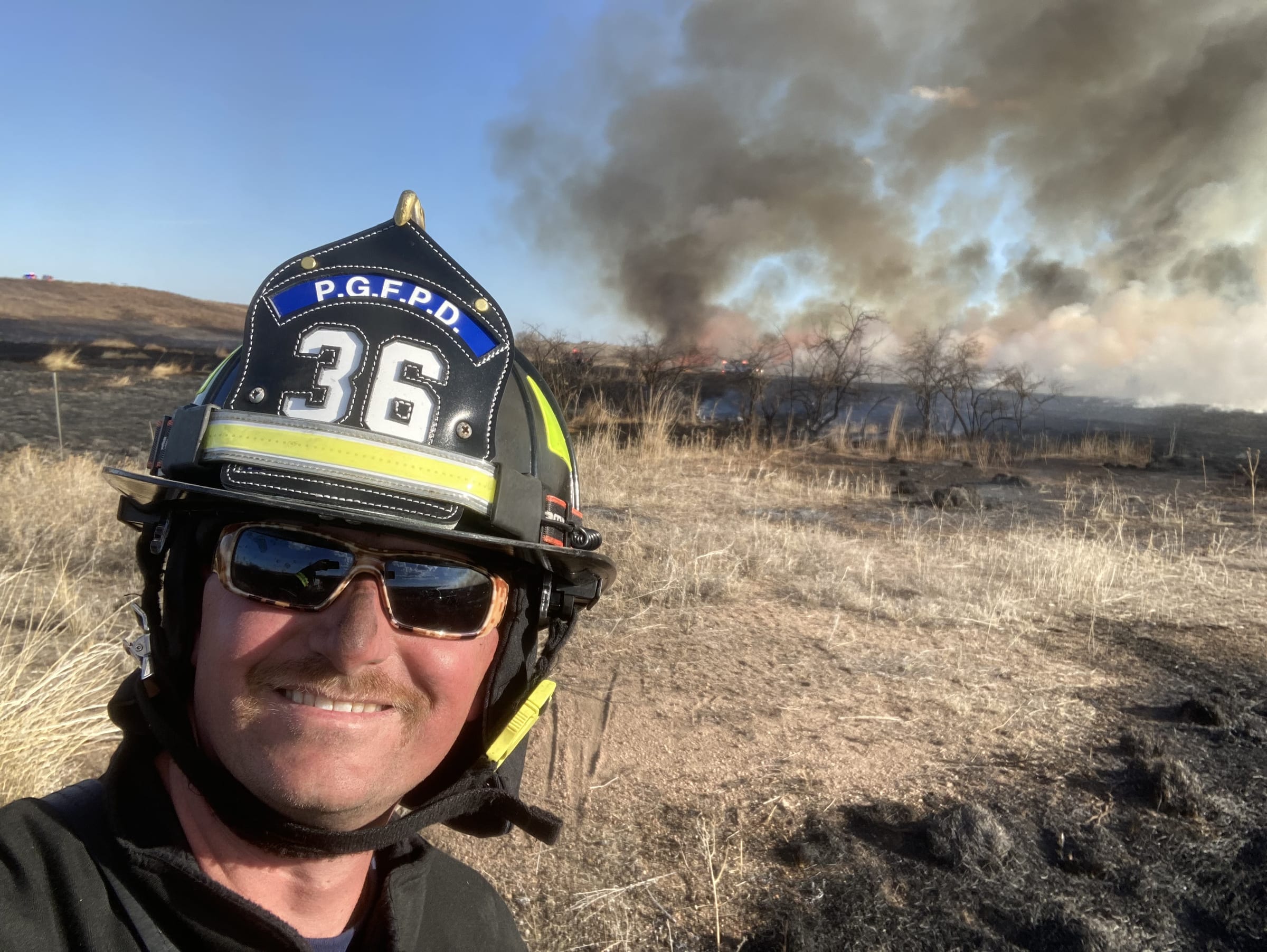 Colorado wildfire response crew near a home